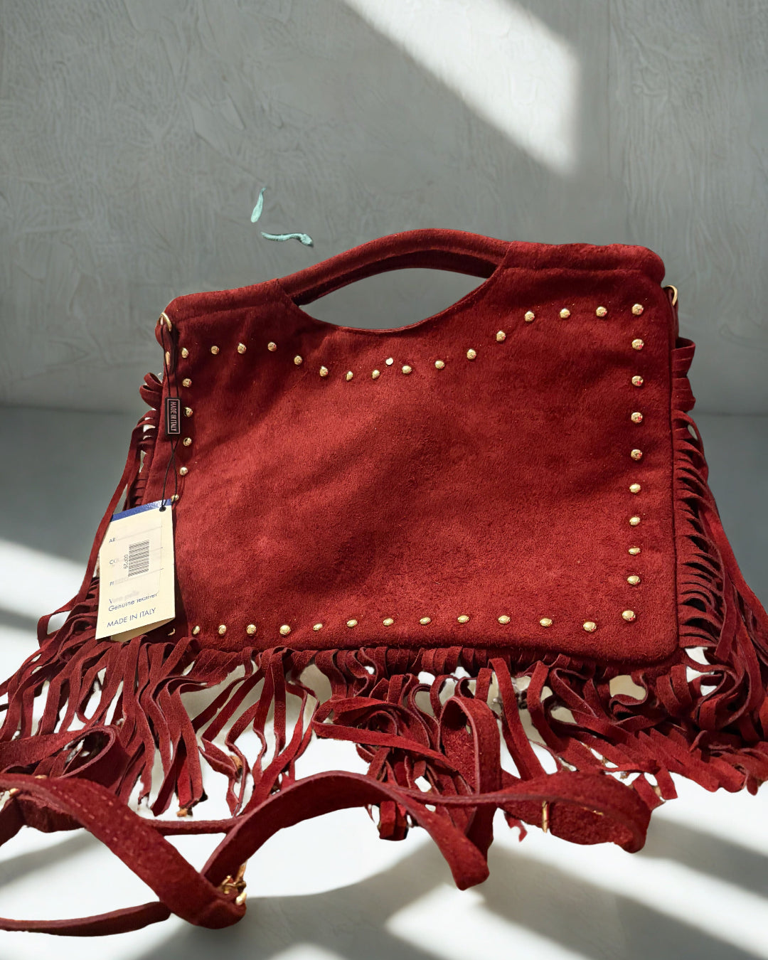 Borsa con borchie e frange