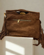 Borsa con borchie e frange